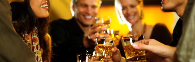 People at a party each enjoying a dram of Scotch Whisky